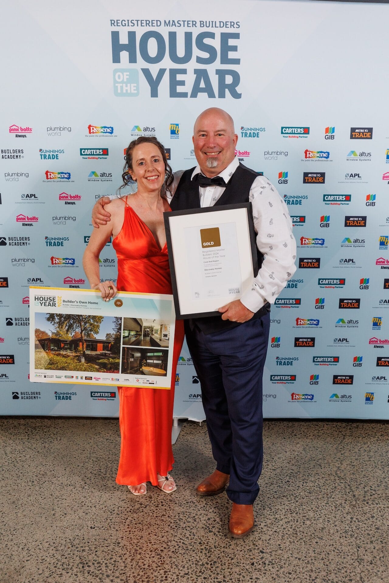 Ben Grady and partner holding the Discovery Homes Gold Award and Builder's Own Home certificate at House of the Year 2024