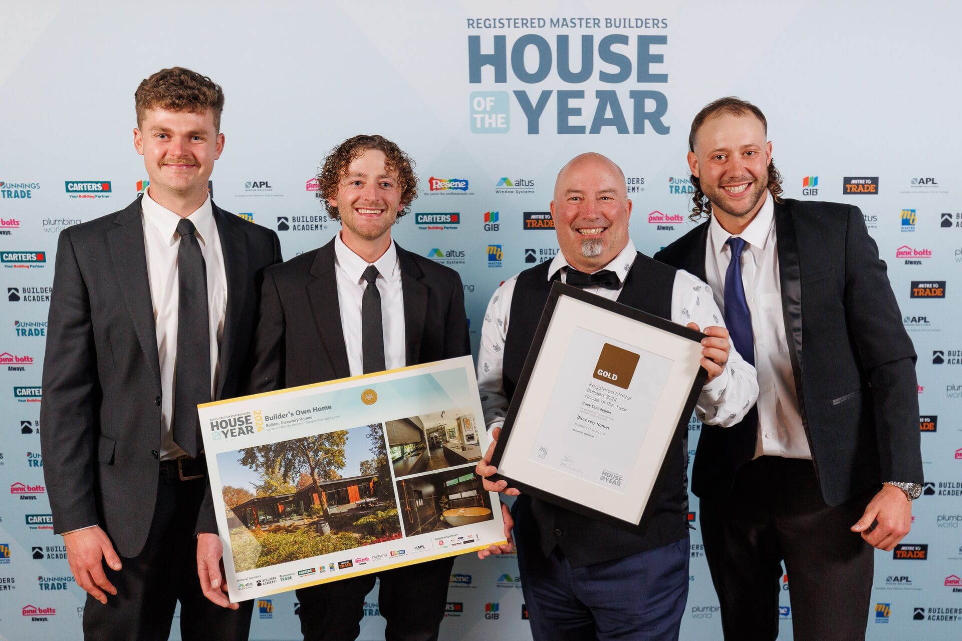 Ben Grady with the Discovery Homes team holding the Gold Award and certificate at House of the Year 2024