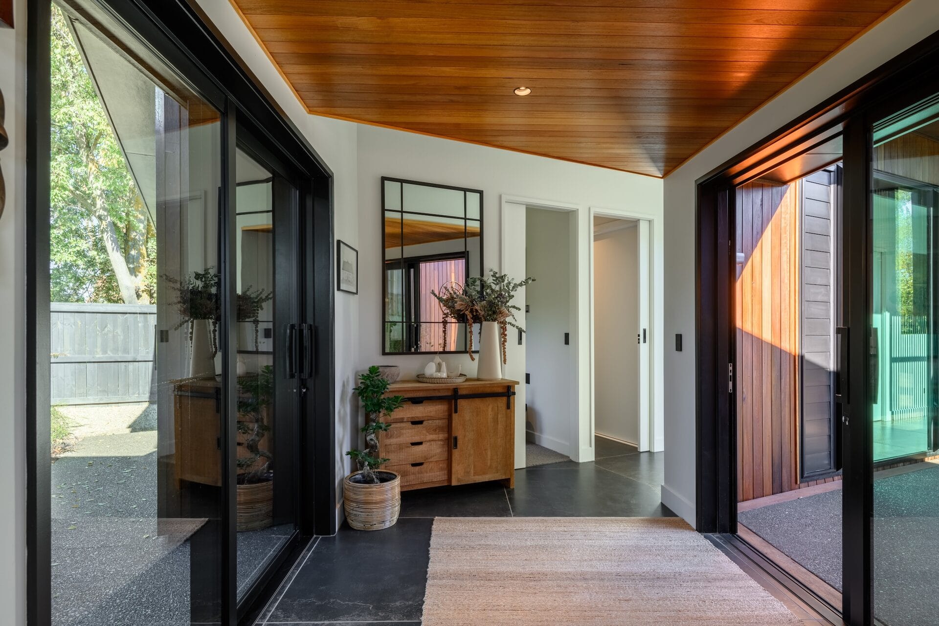 Grady Home — entry atrium with Tallowwood ceiling