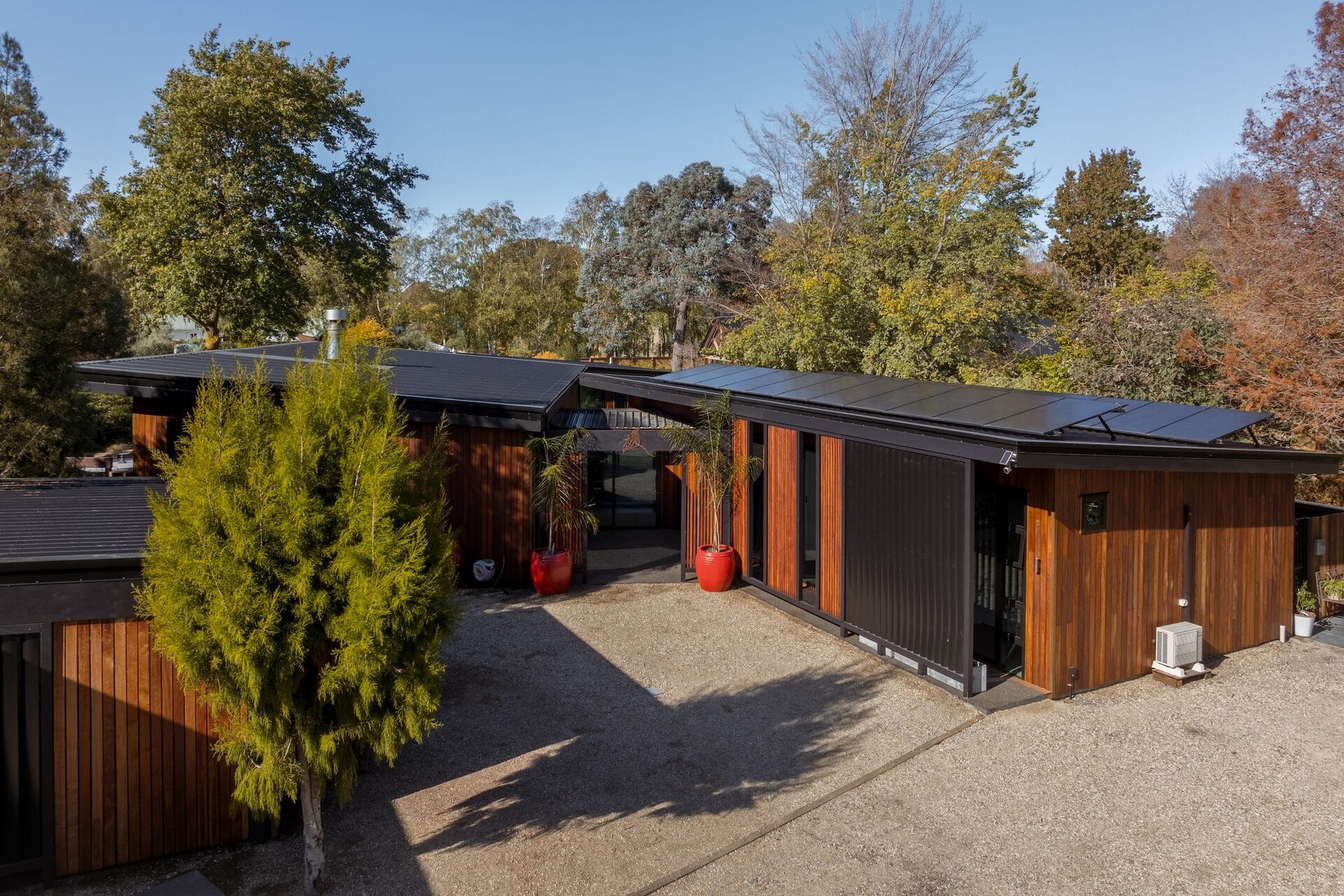 Grady Home — front facade with Tallowwood cladding and solar panels