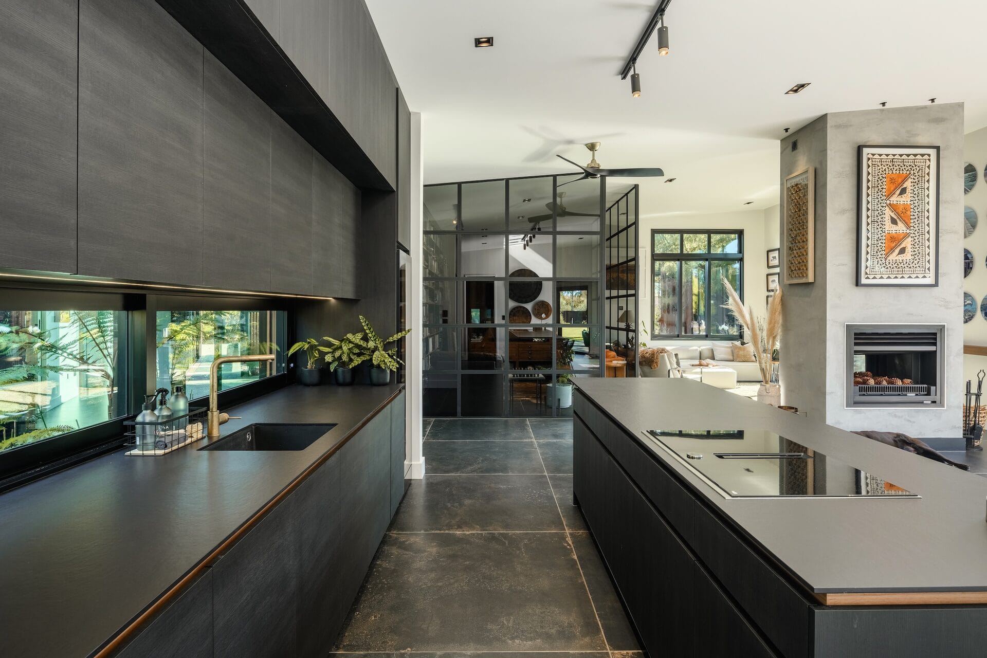 Grady Home — kitchen with large Italian tiles and glass wall beyond
