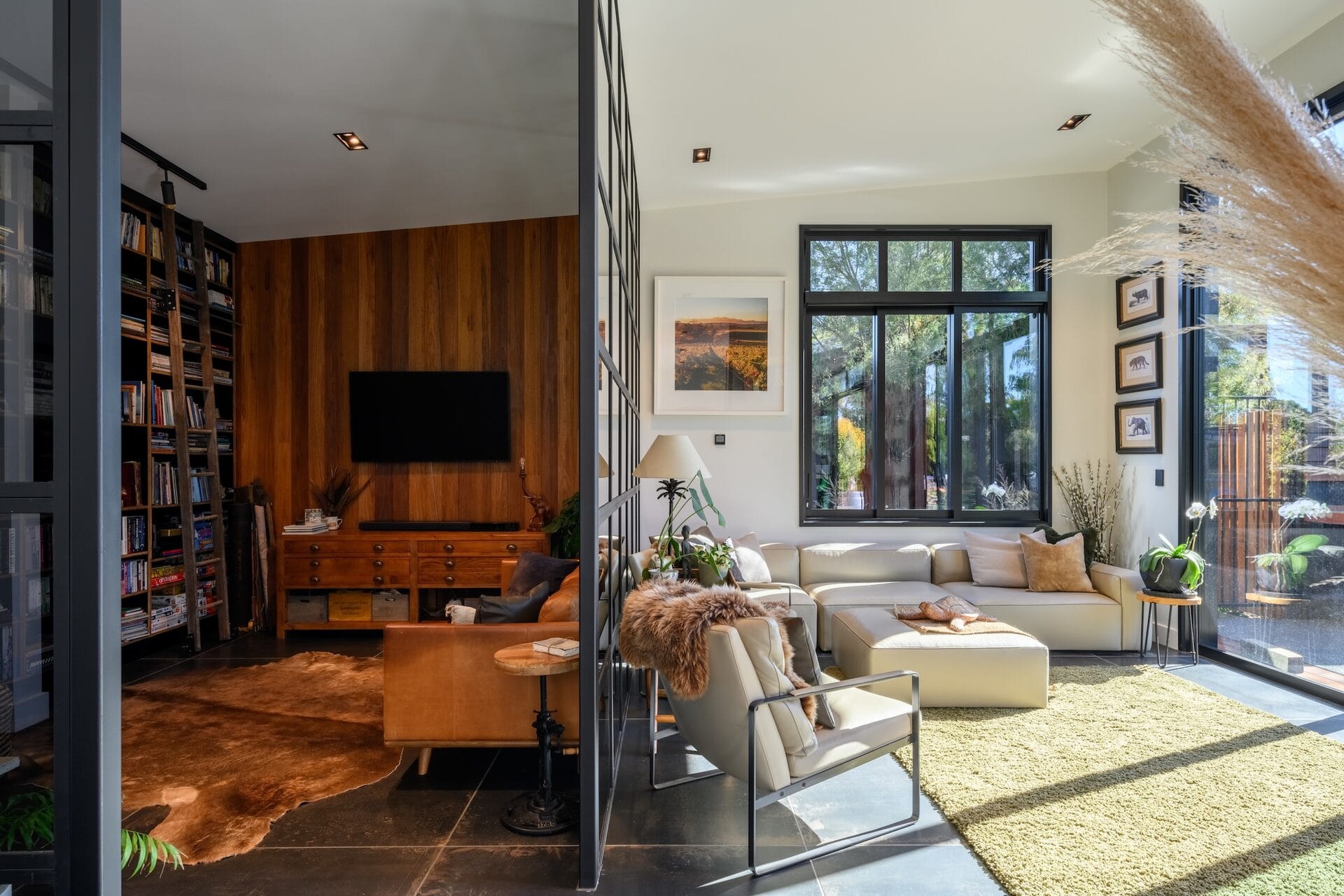 Grady Home — library and lounge separated by steel and glass wall