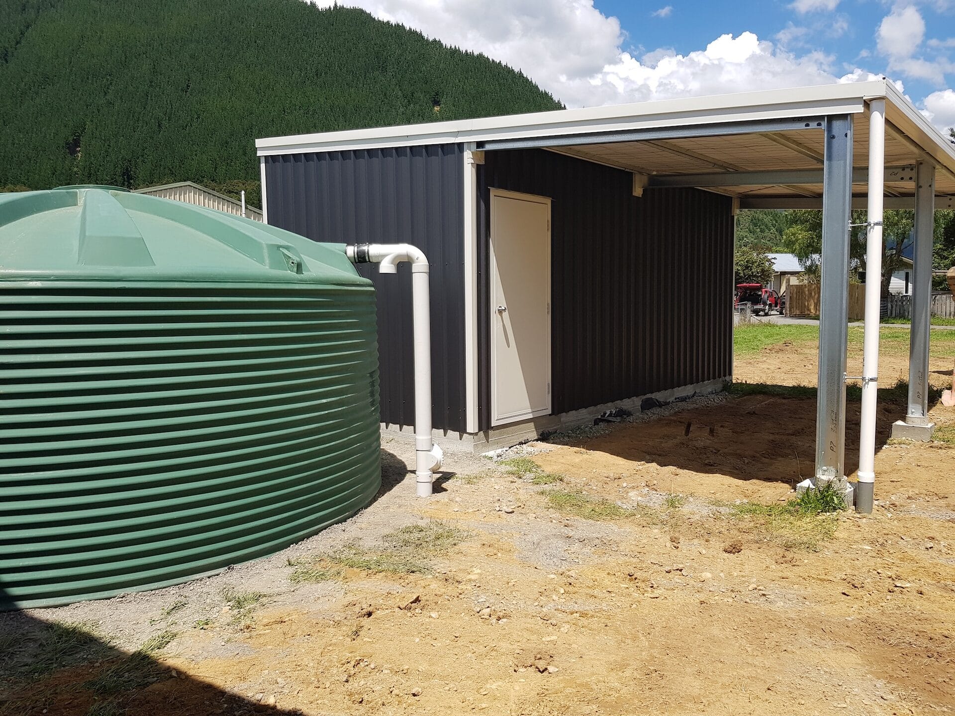 Gregory Home — rainwater collection tank and utility shed