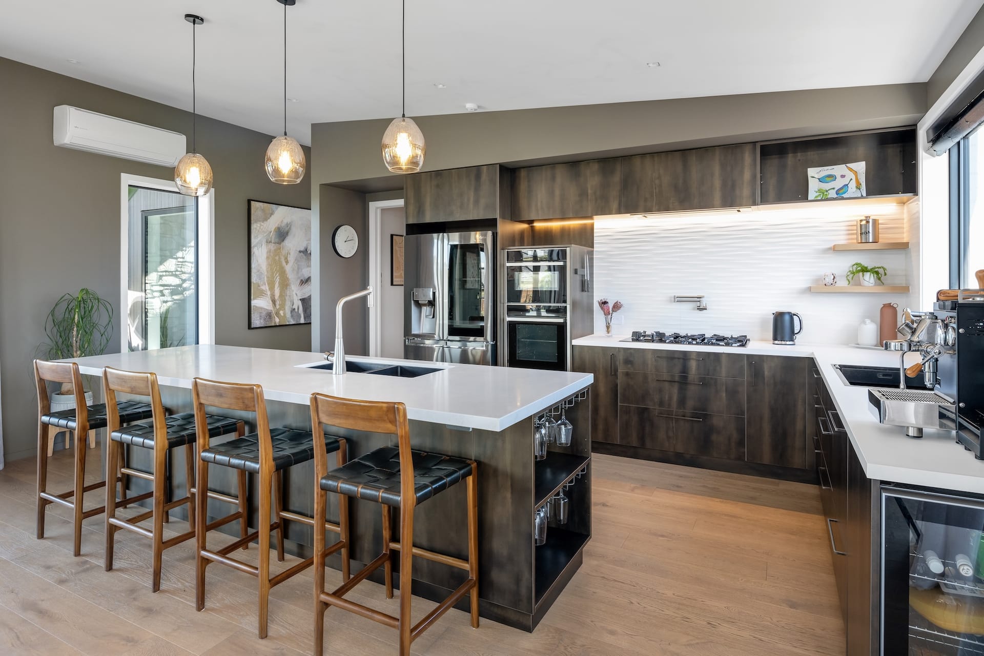 Spitfire Drive kitchen with leather barstools and pendant lighting