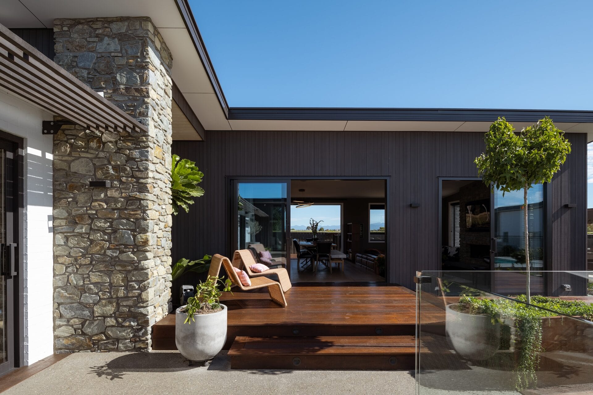 Pope Home — Abodo cladding and stone chimney