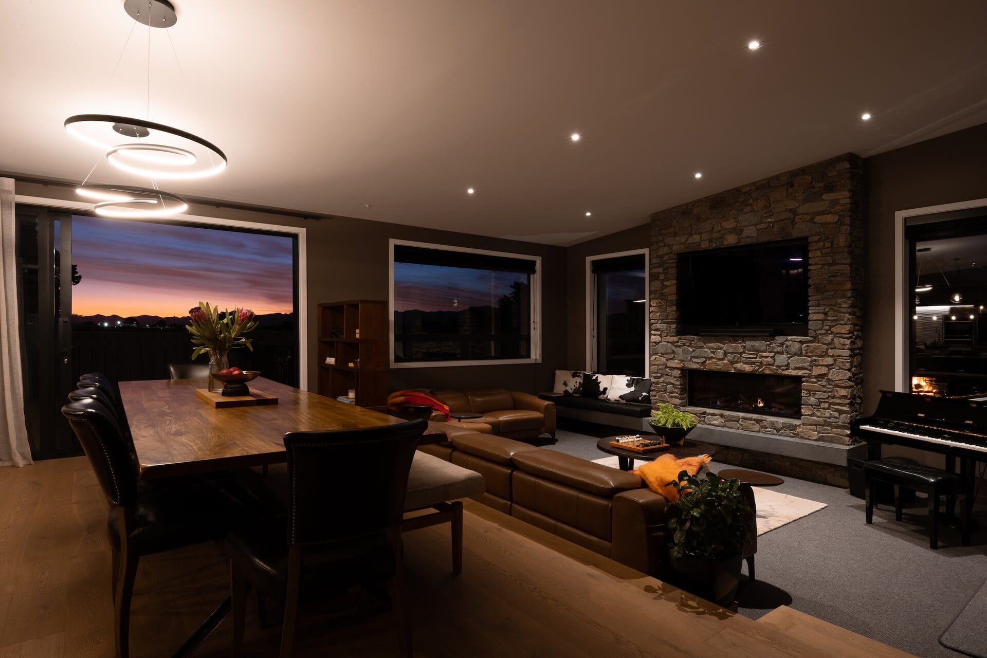 Pope Home — sunken lounge and stone fireplace