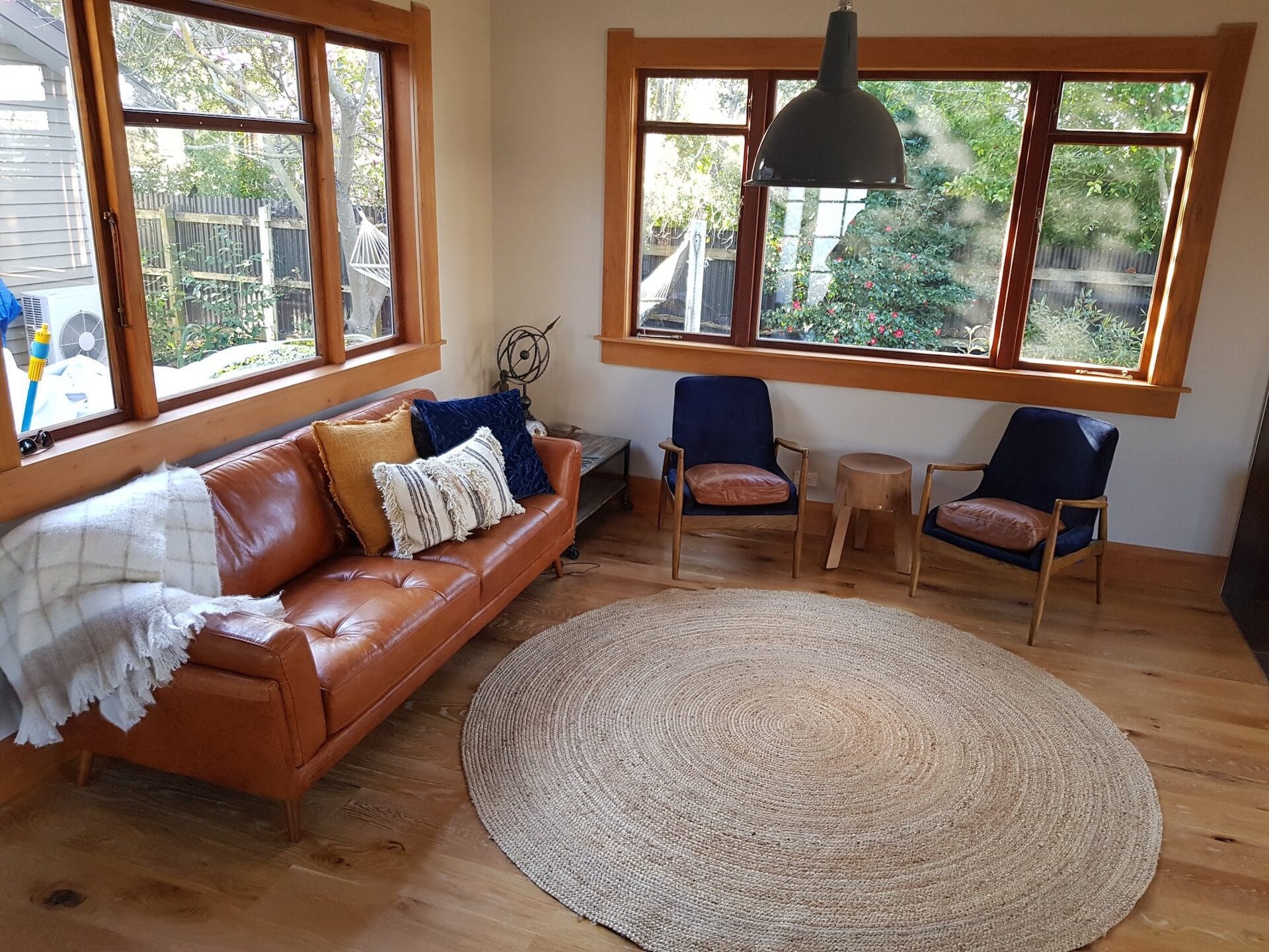 Severne St — sitting area with original timber-framed windows looking onto the garden