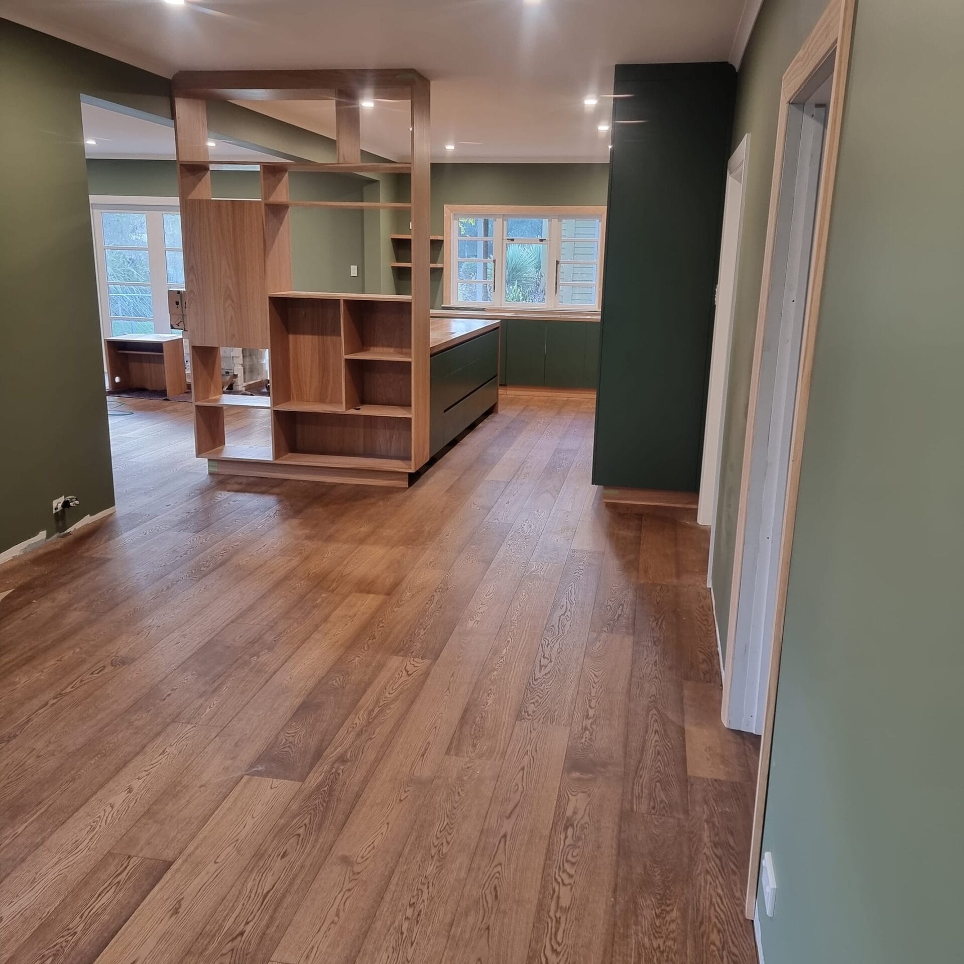 Smalls — open plan kitchen and dining looking through the timber shelving